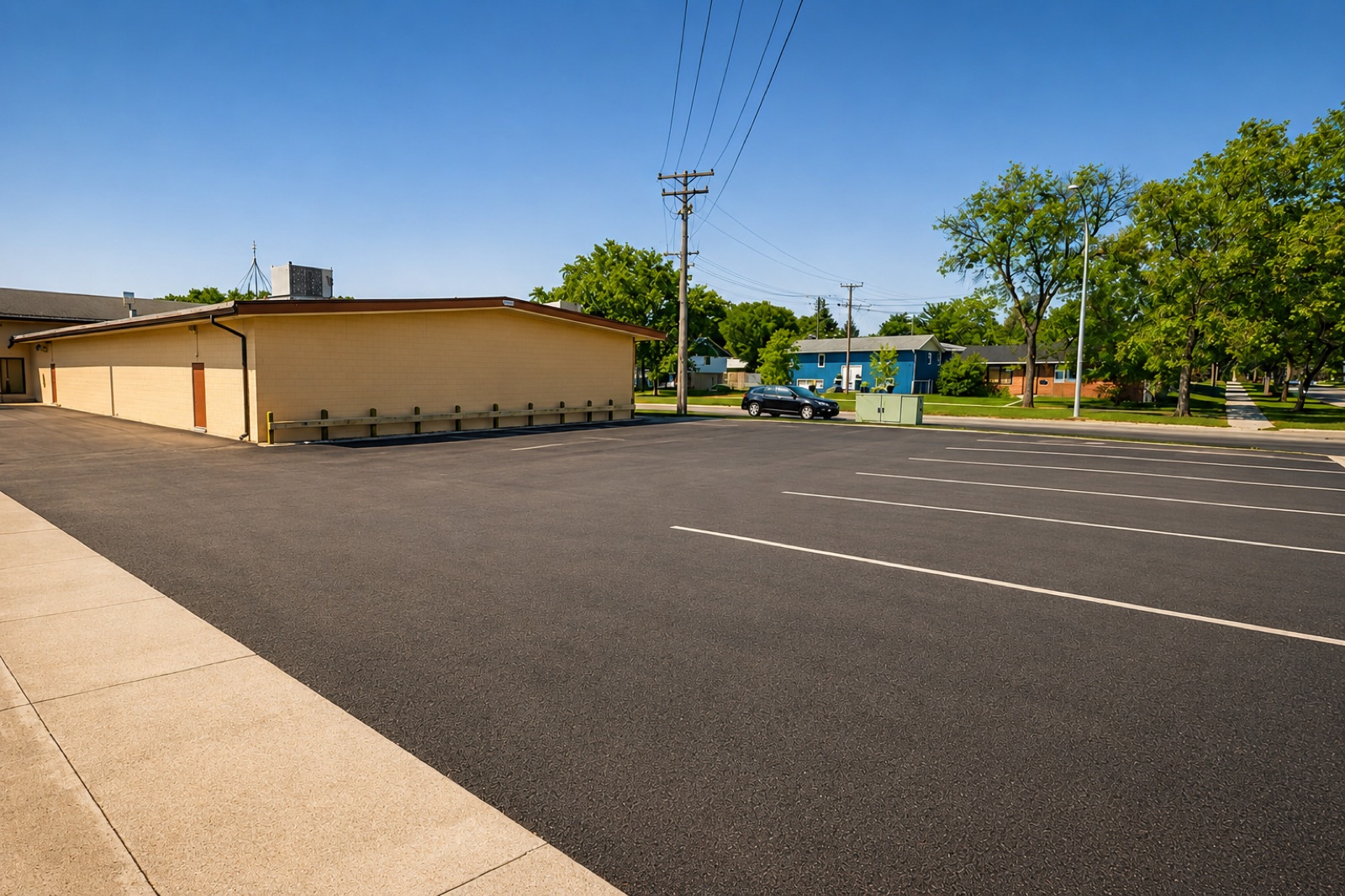 Large private parking lot beside the hall entrance